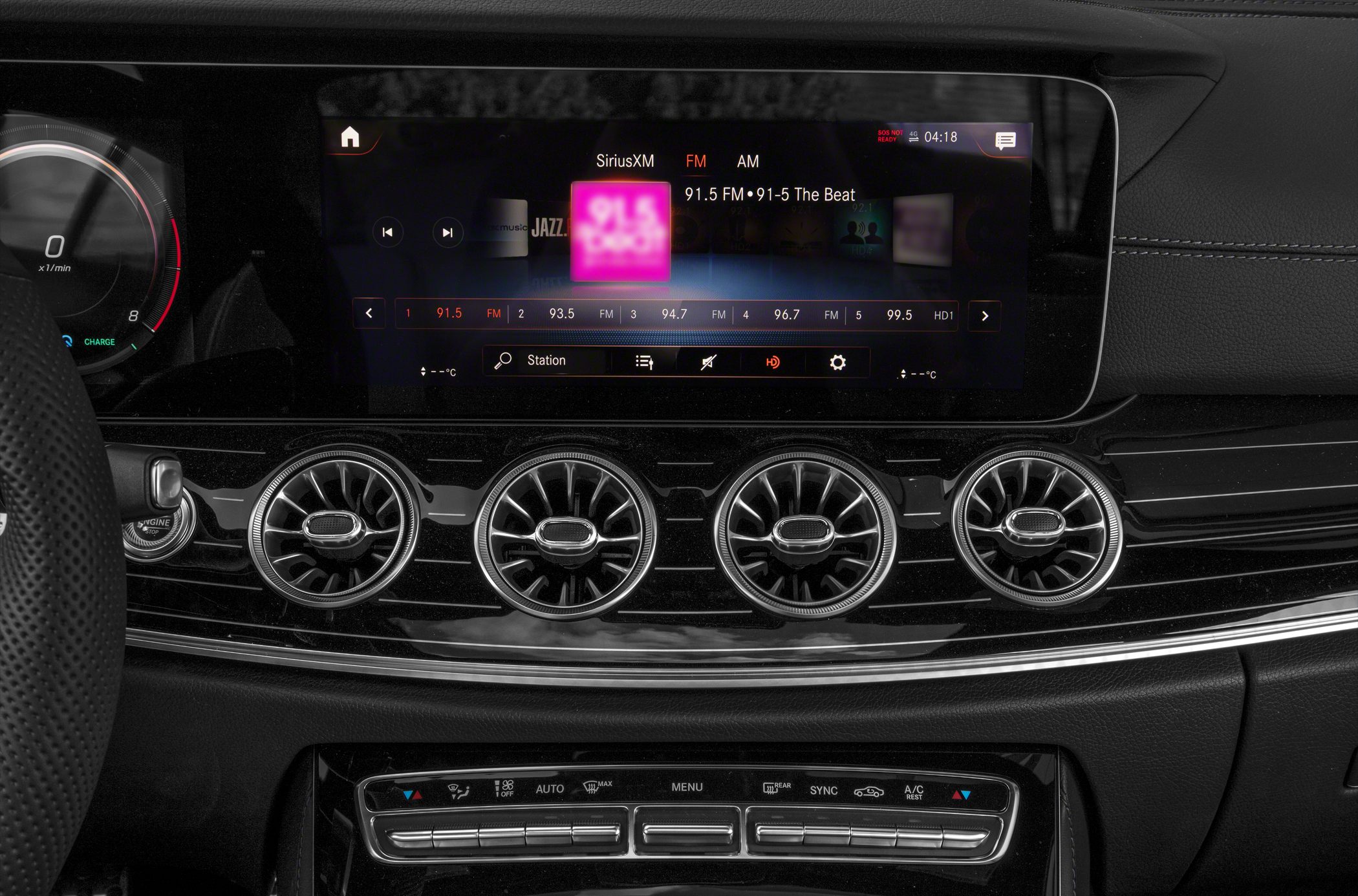 Widescreen digital display with four turbine-style air vents and advanced climate controls