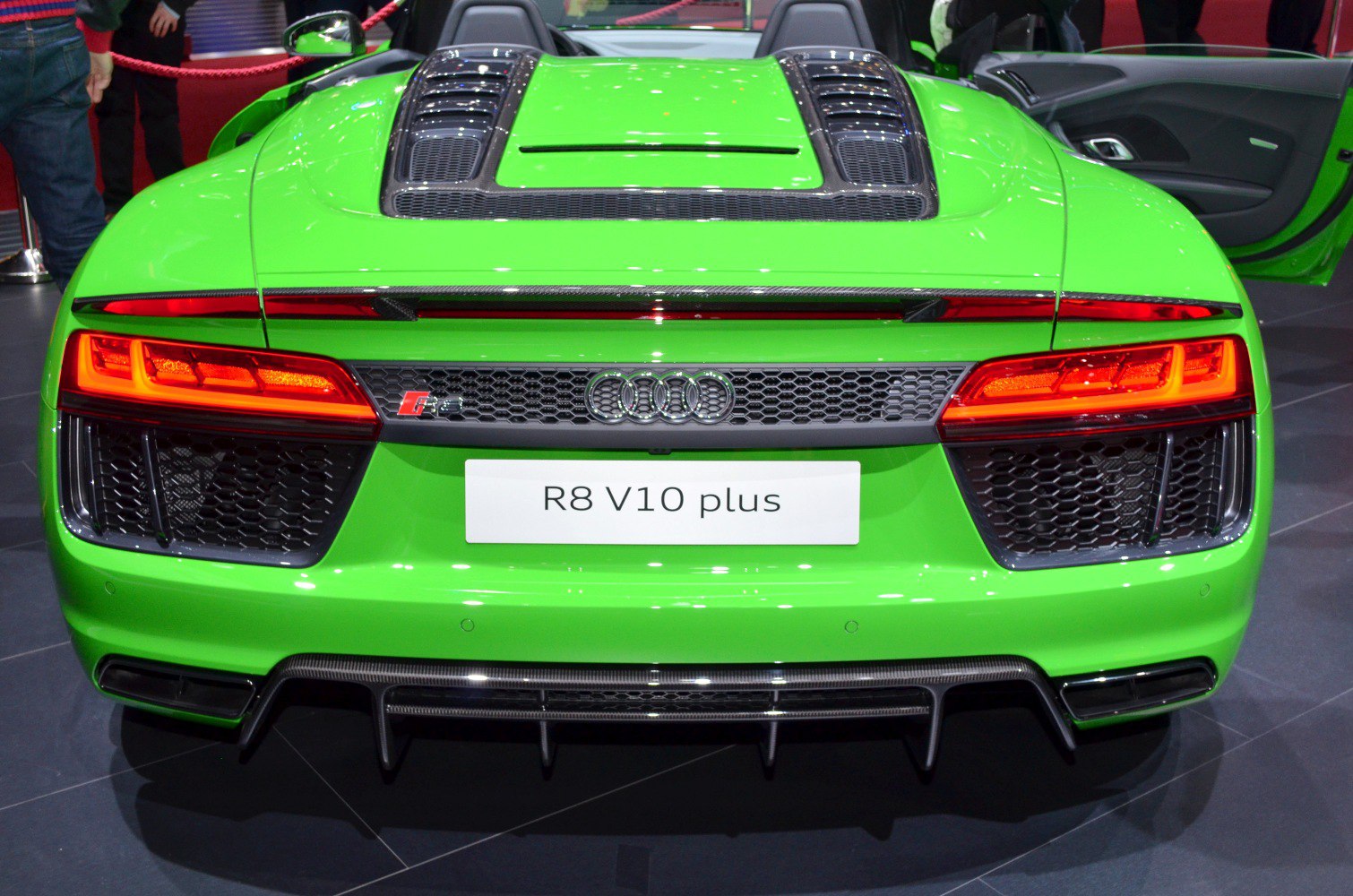 Rear view with illuminated taillights and V10 plus badge