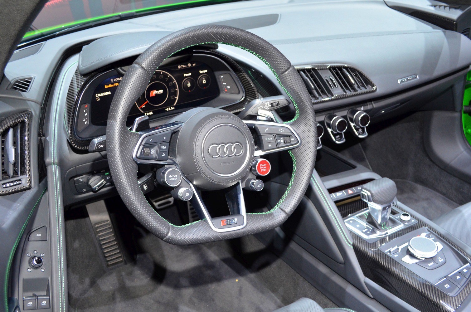 Audi sports steering wheel and digital dashboard in luxury interior