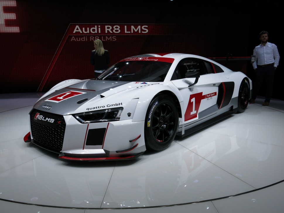 Aerodynamic race car front side with white racing livery and black wheels