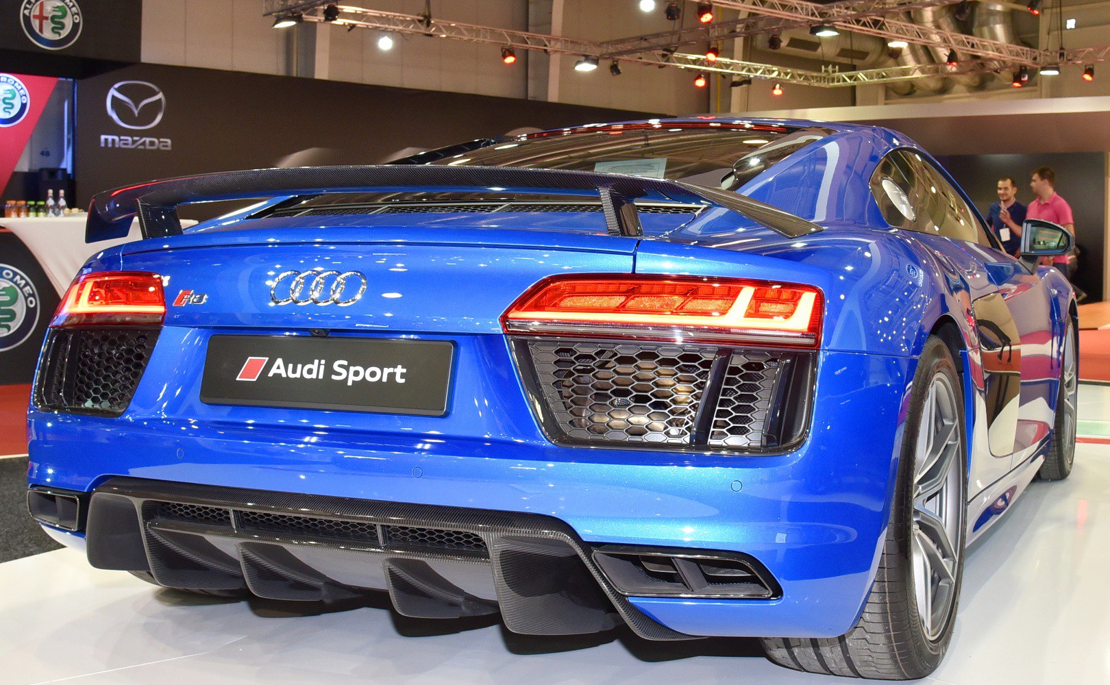 Rear view with spoiler, taillights, diffuser, and exhaust