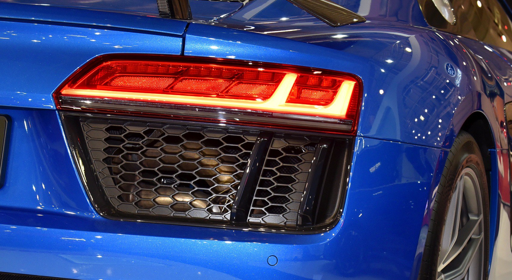 Rear LED taillight and hexagonal grille air intake on blue body