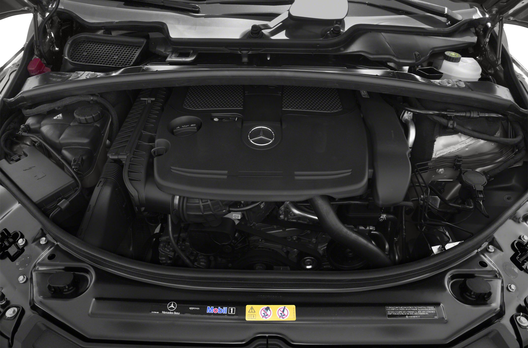 Engine compartment with Mercedes-Benz emblem and engine cover