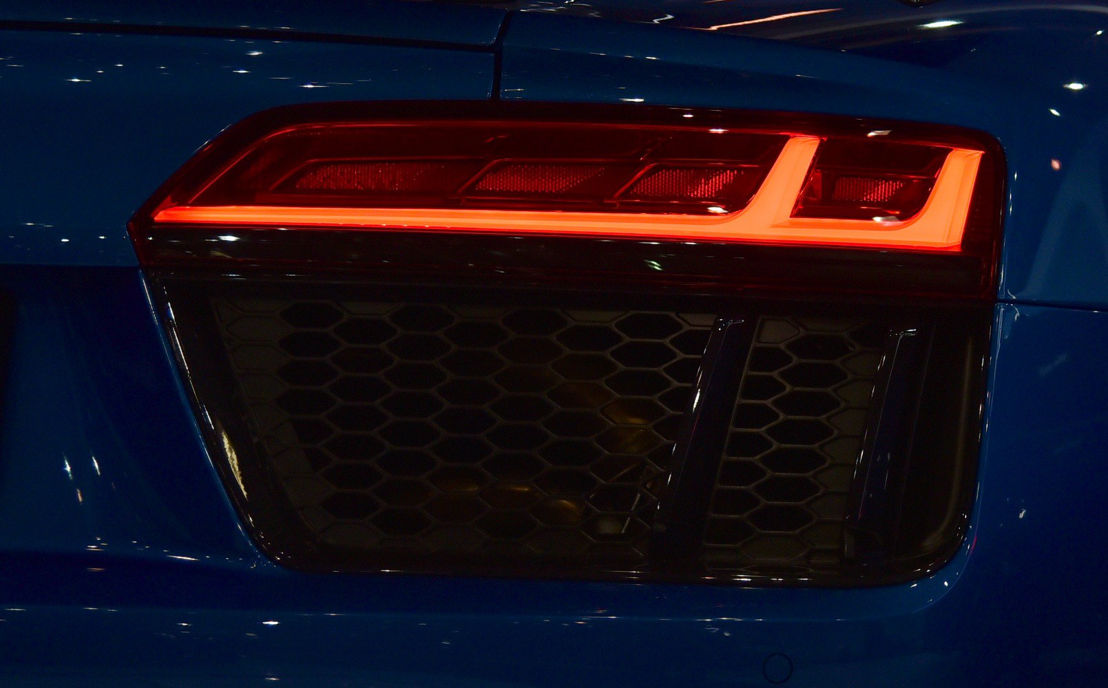 Close-up of rear LED tail light and honeycomb vent