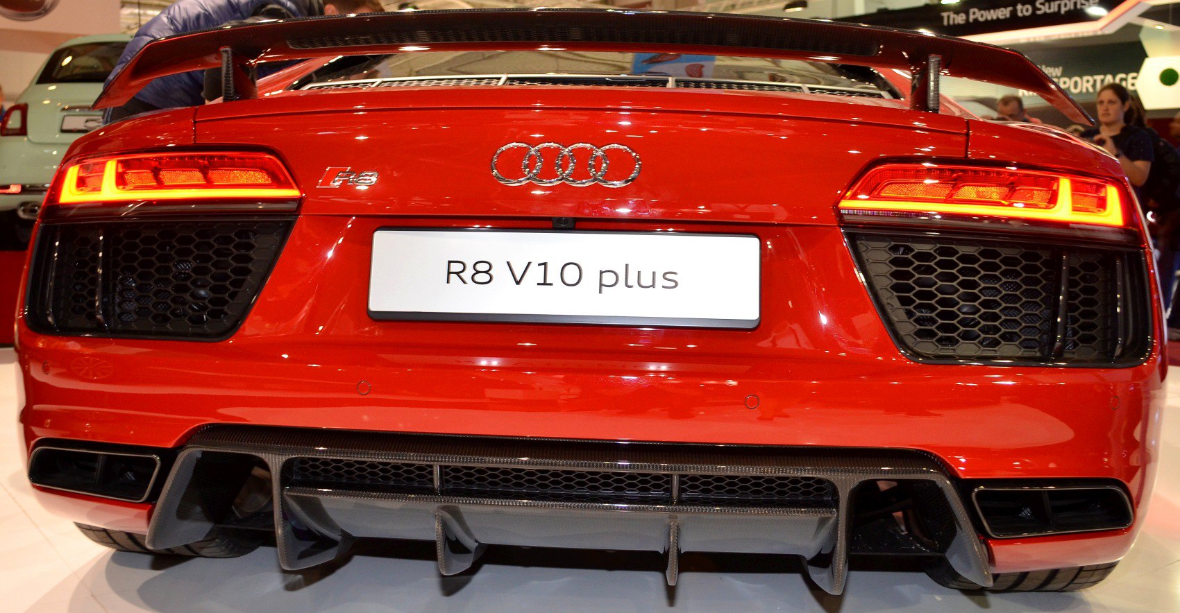 Rear LED taillights and sporty diffuser of a red high-performance car