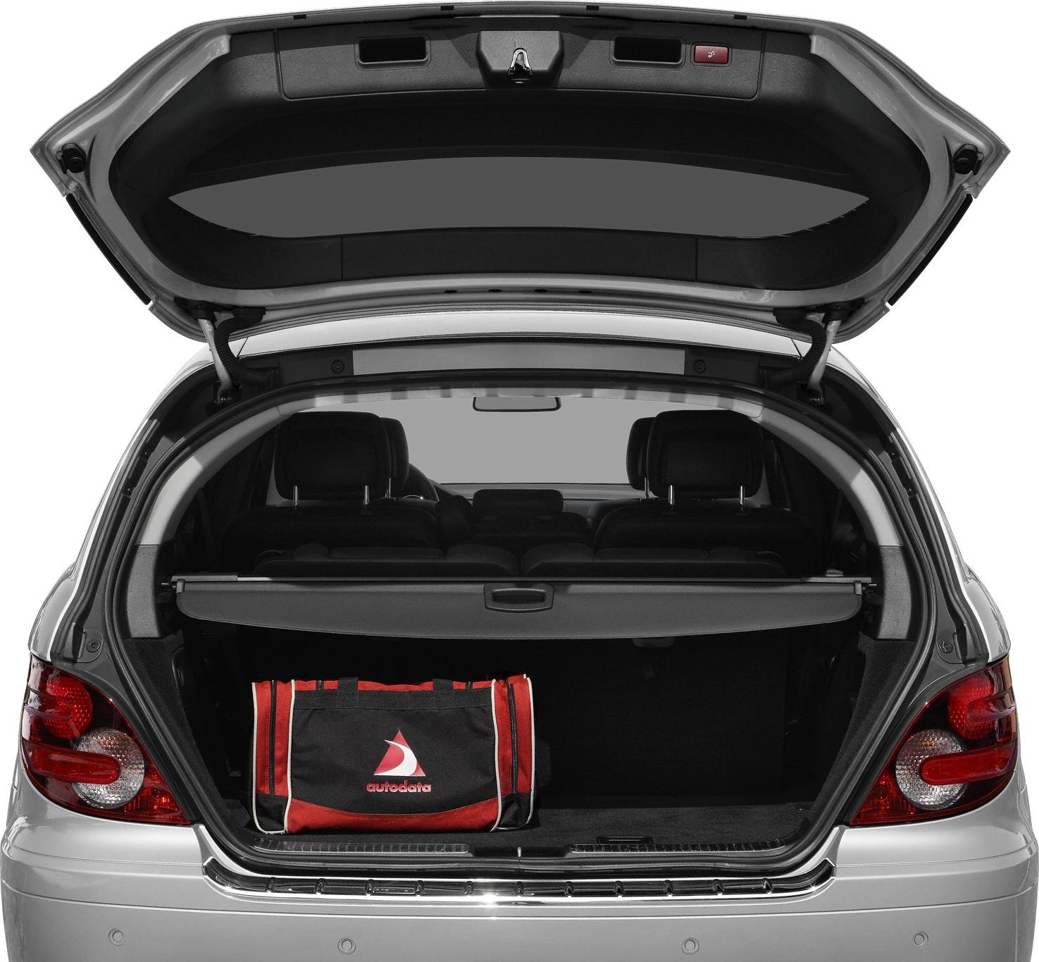 Open rear trunk with cargo cover and visible rear seats headrests