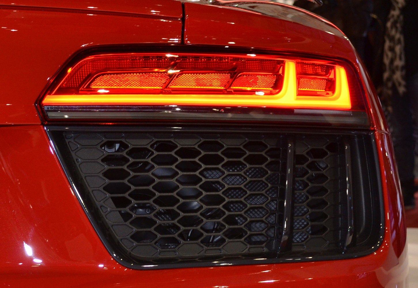 Close-up of rear LED tail light and honeycomb grille