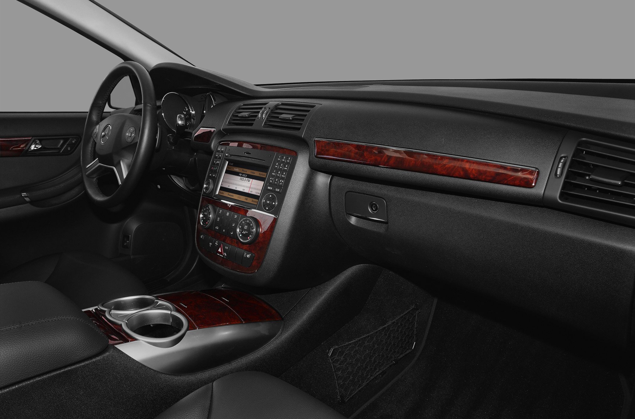 Luxury dashboard and center console with wood trim and multimedia controls