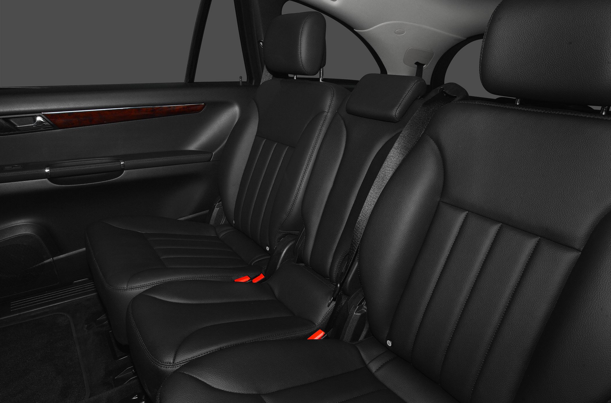 Rear black leather seats with headrests and seat belts