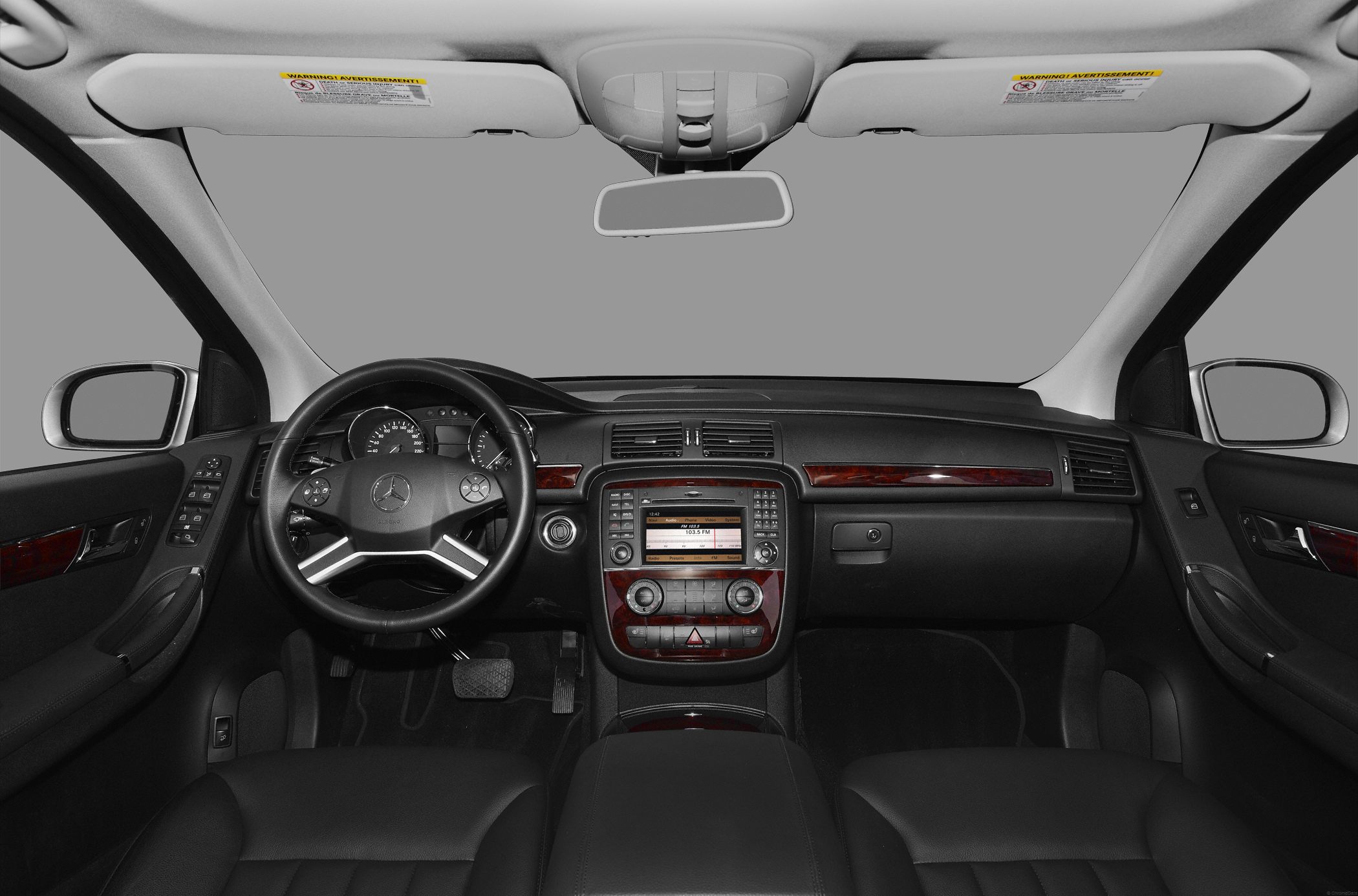 Luxury car interior with dashboard, steering wheel, and center console