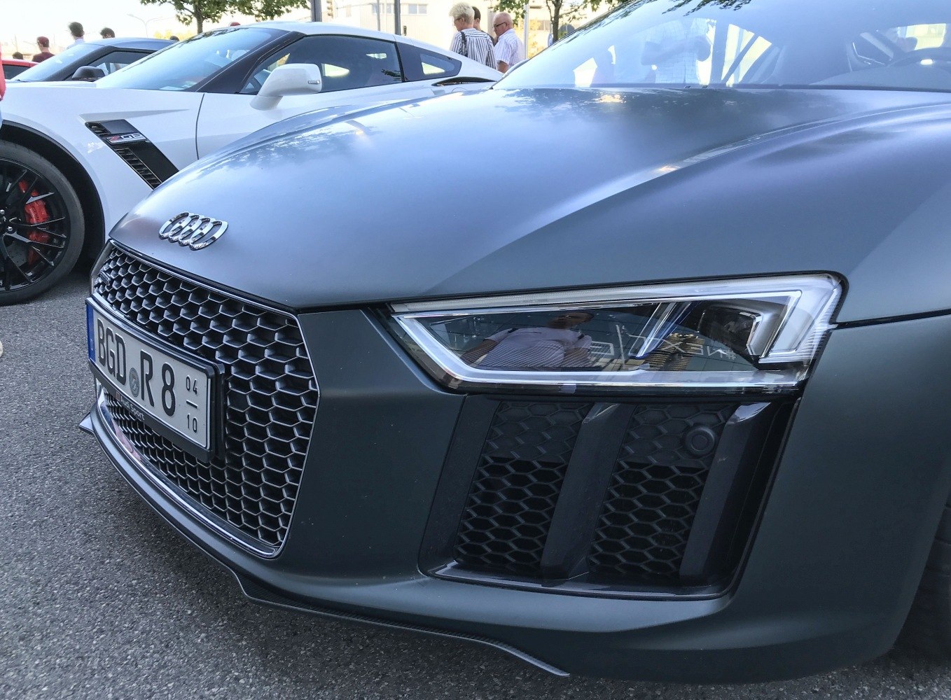 Close-up of front grille and sleek headlight with hexagonal design