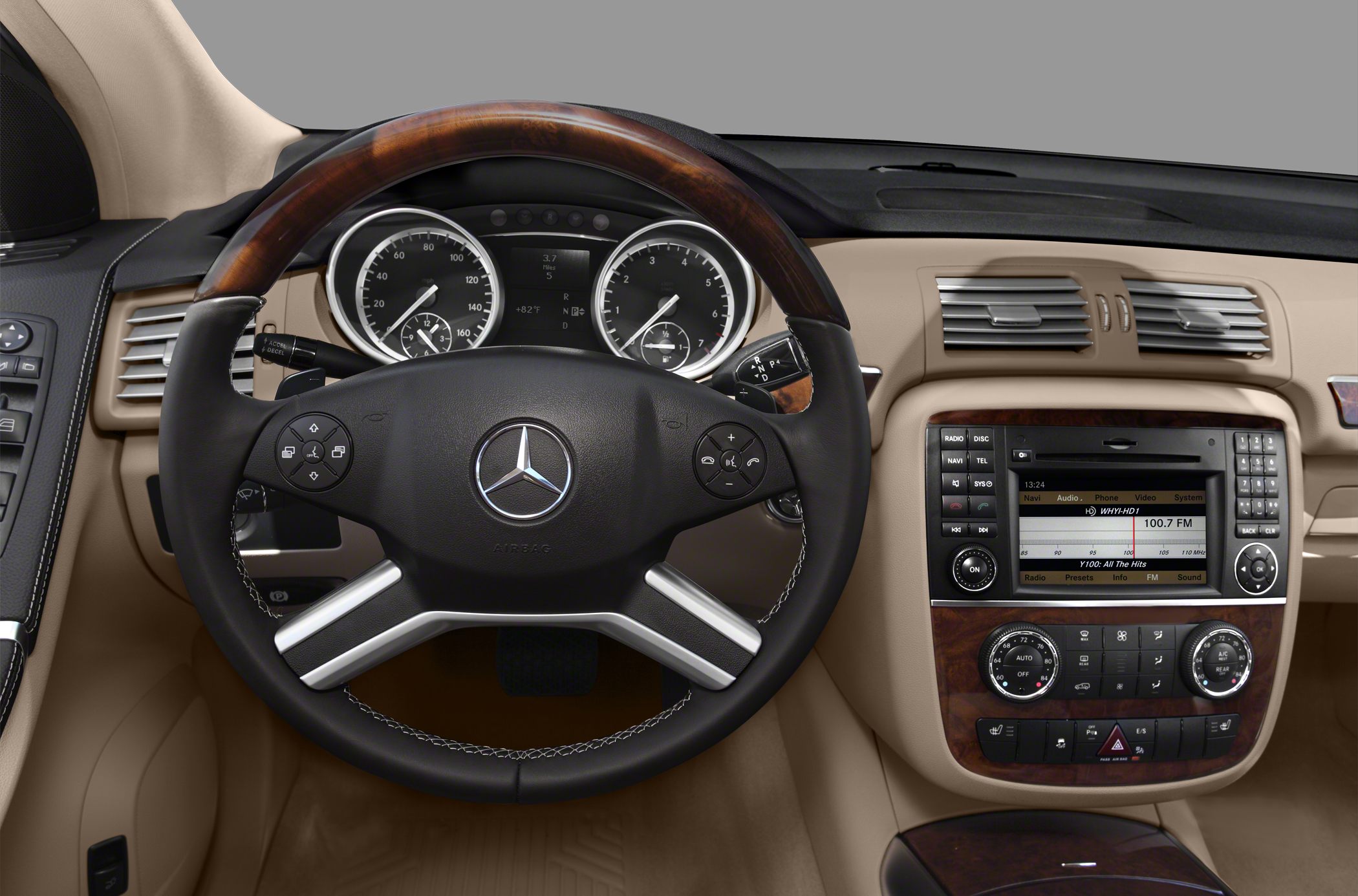 Luxury interior with wood-accented steering wheel and advanced dashboard controls