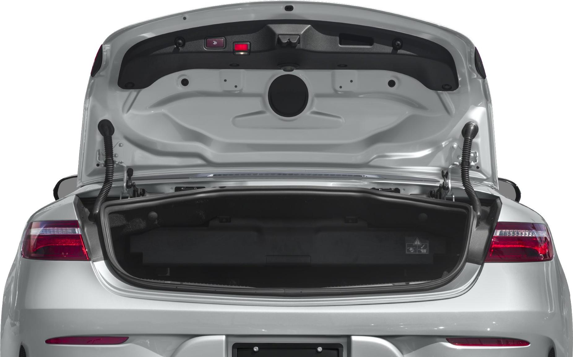 Open trunk interior with structural details and trunk lid components.