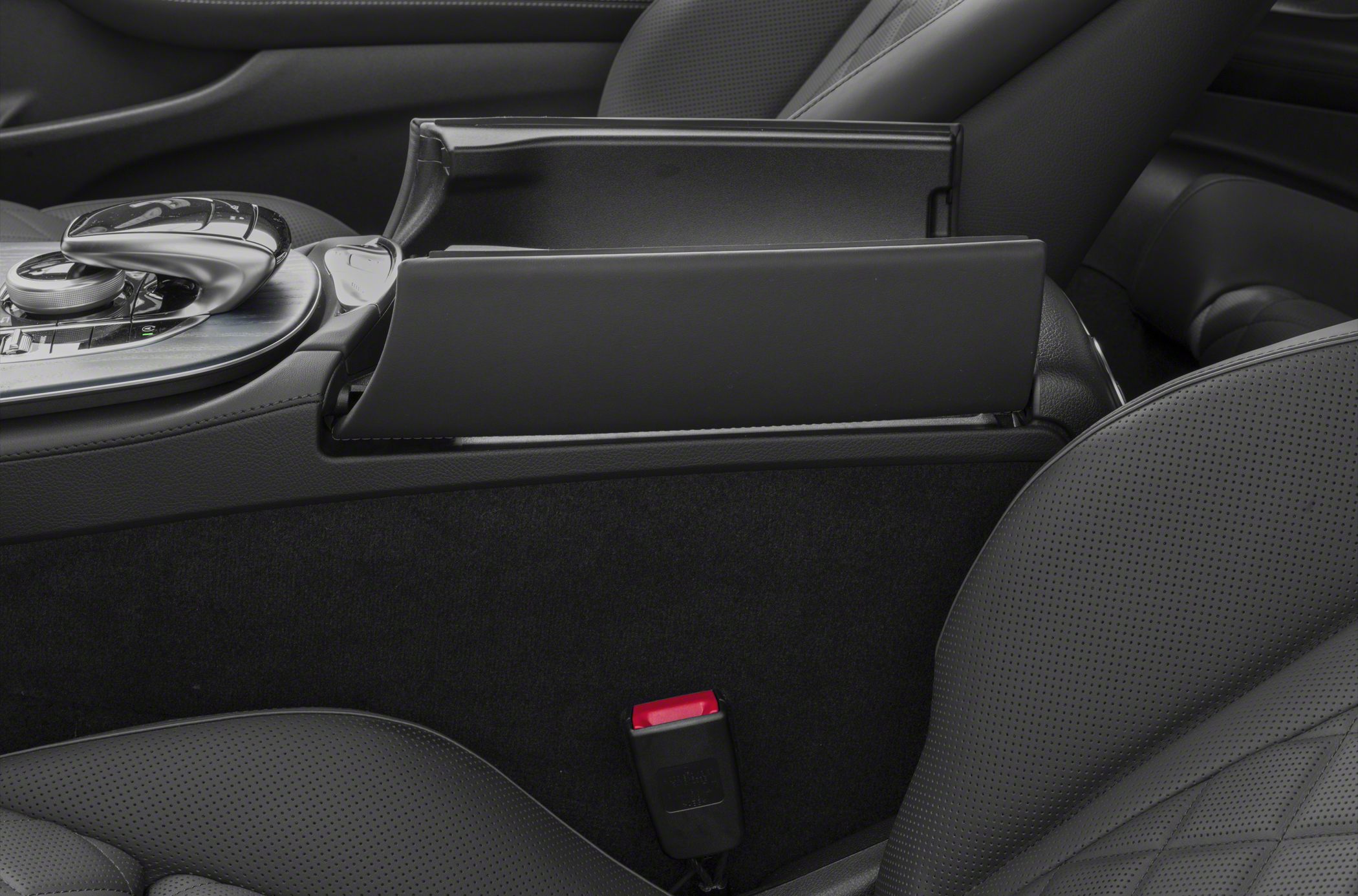 Close-up of center console storage and perforated leather seats