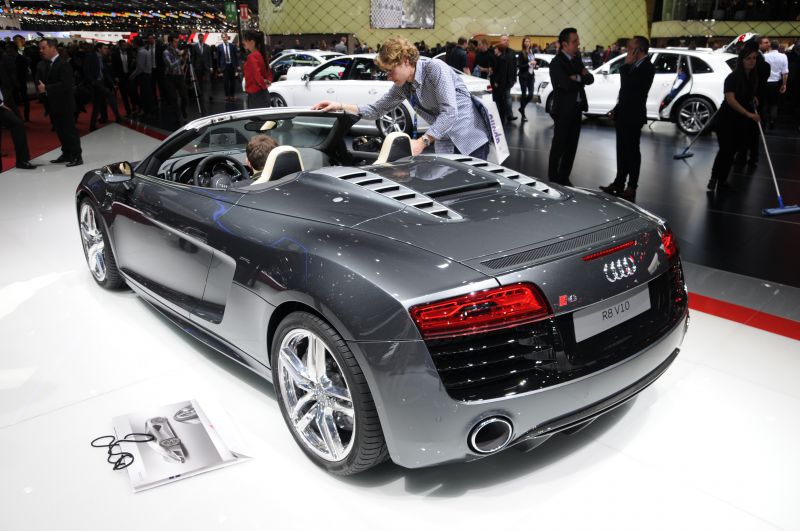 Rear and side view of a sleek convertible with aerodynamic vents and distinctive taillights
