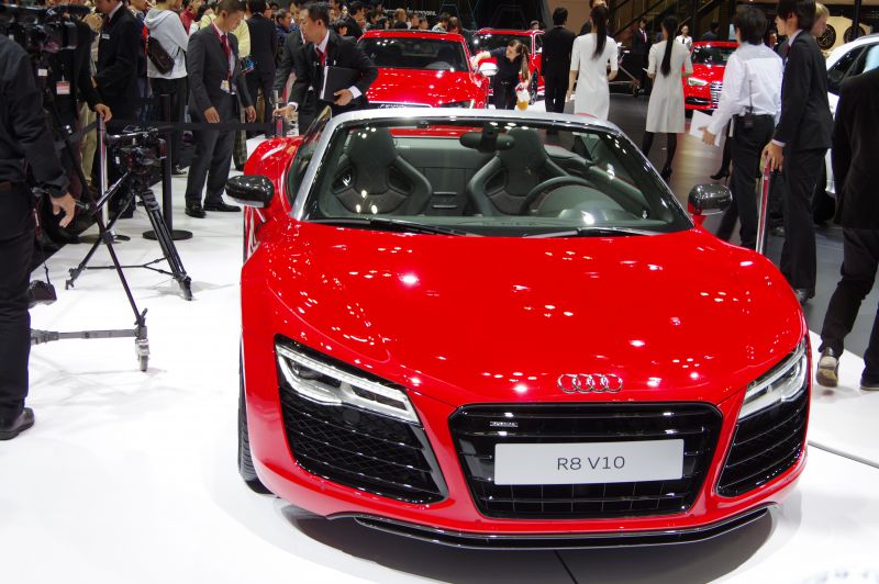 Red convertible with distinctive front grille and LED headlights