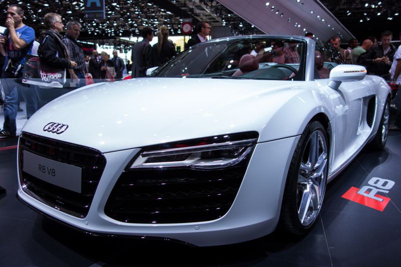 Front view of a white convertible with LED headlights and sporty design
