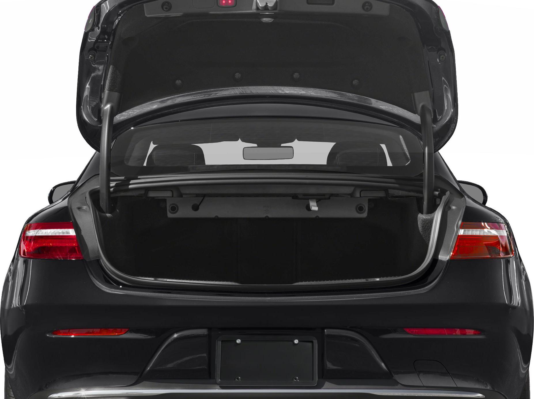 Open rear trunk of a luxury coupe with spacious cargo space and visible taillights