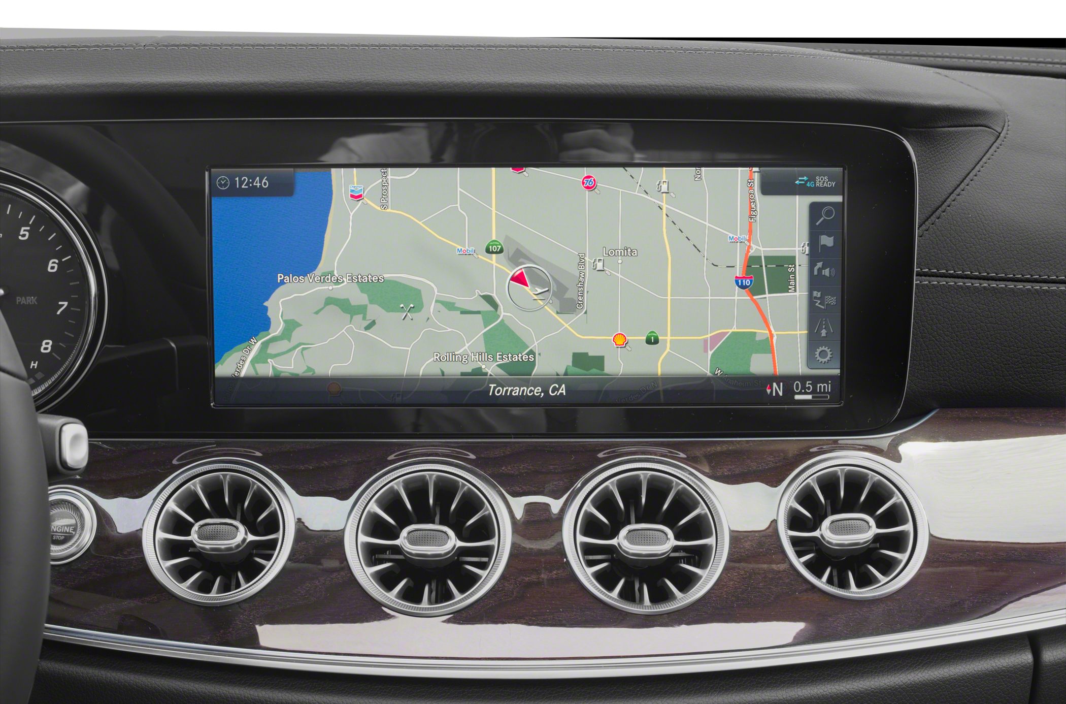 Car interior with digital navigation screen and turbine-style air vents