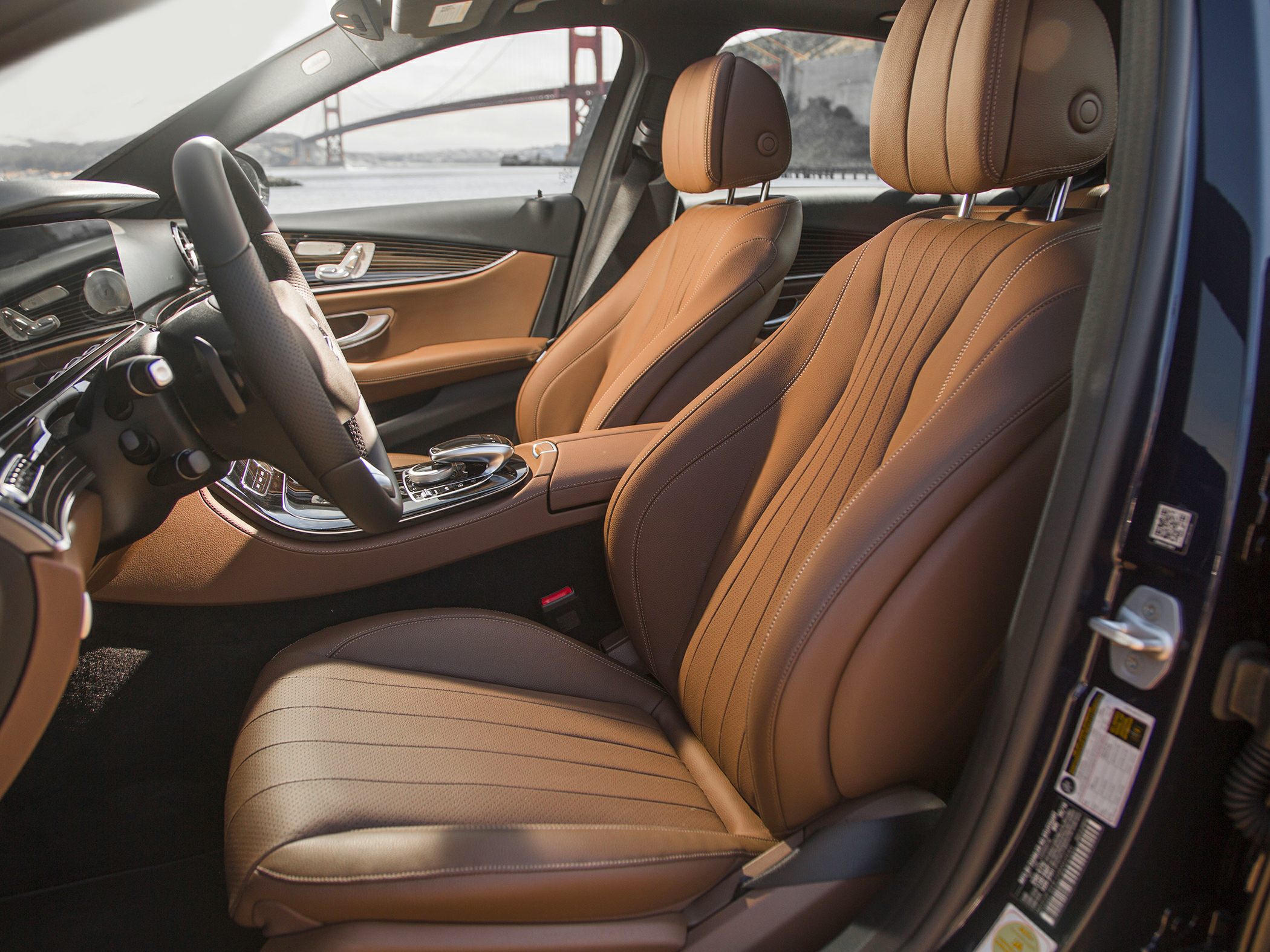 Tan leather seats and sophisticated dashboard interior design