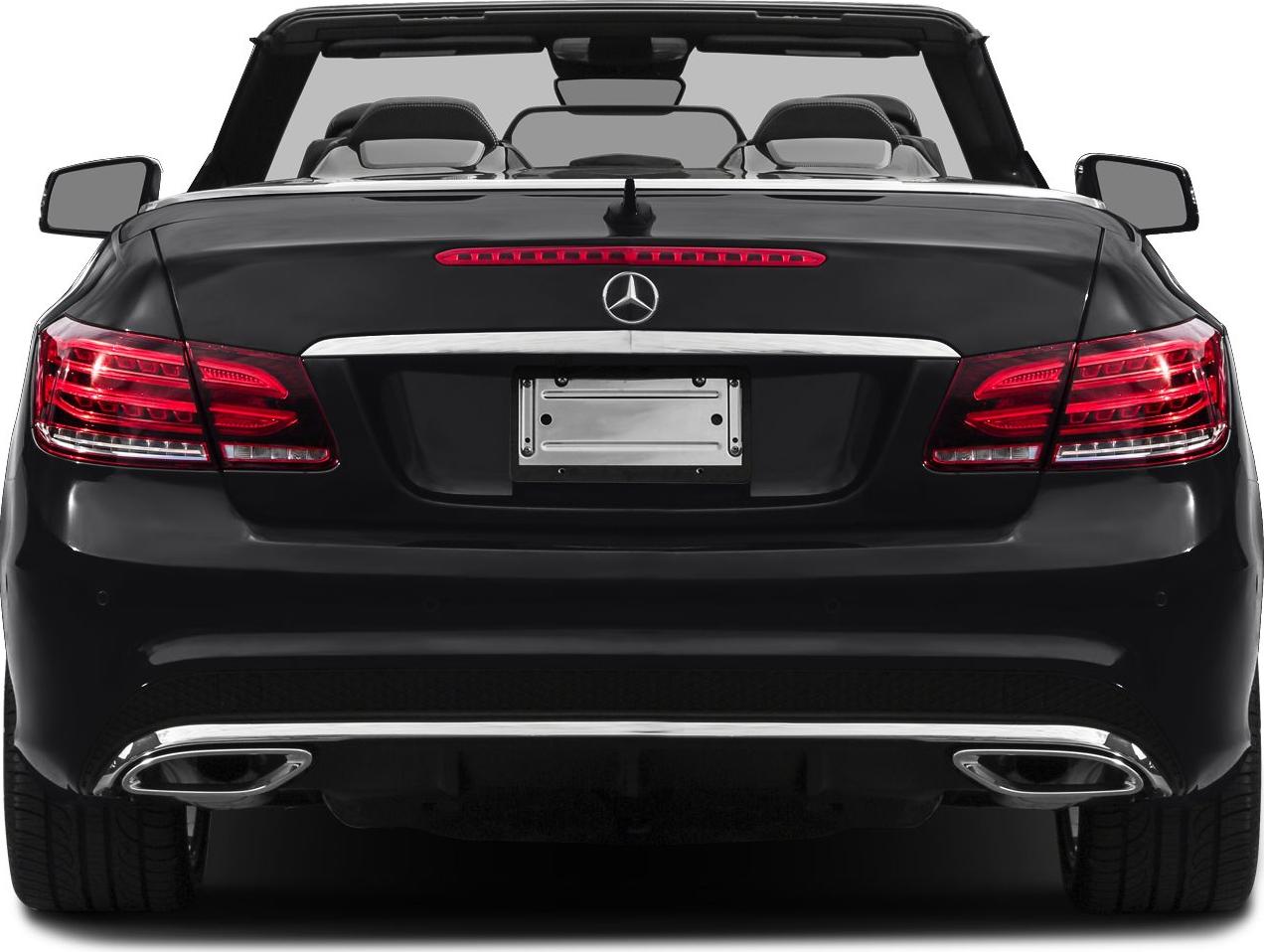 Rear view of convertible with distinct taillights and dual exhausts