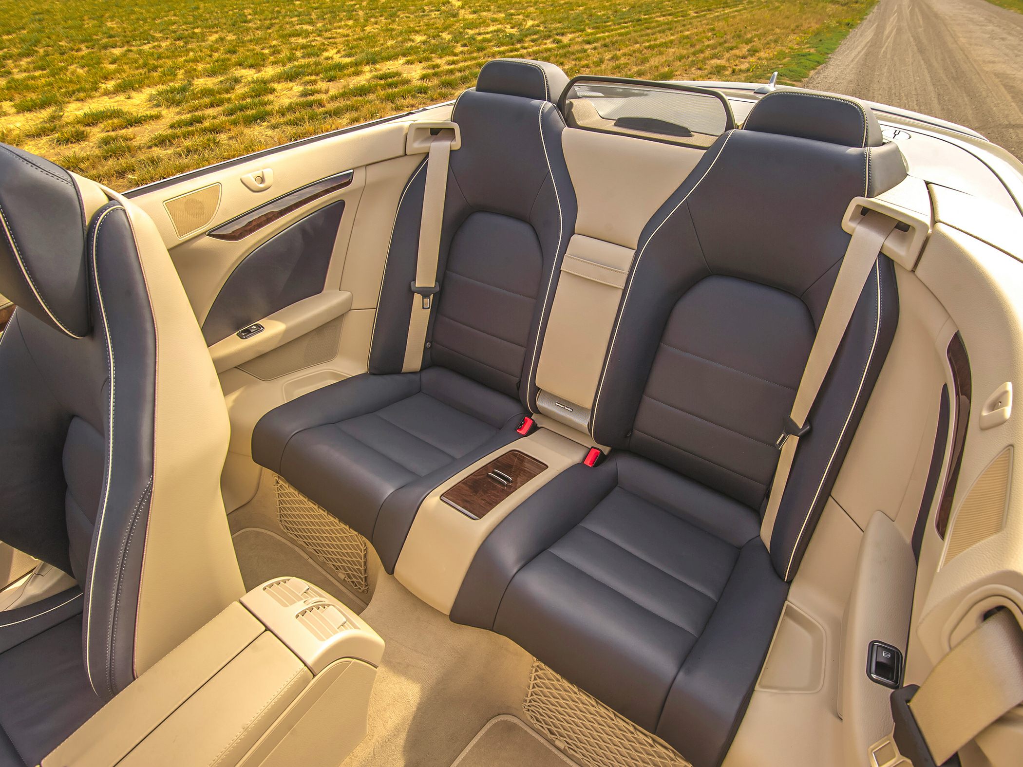 Luxurious rear seats with leather upholstery and wood trim