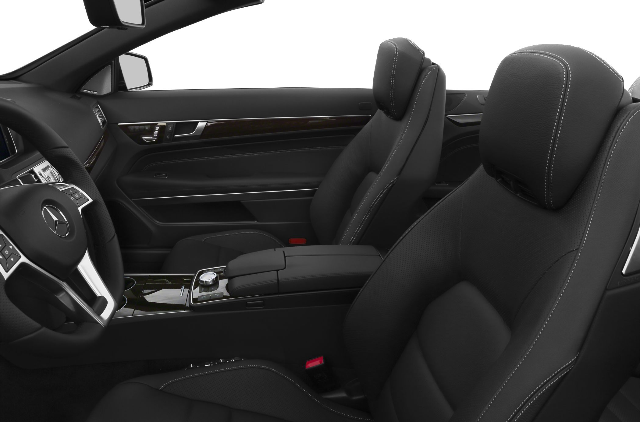 Black leather front seats and dashboard interior with wood trim details