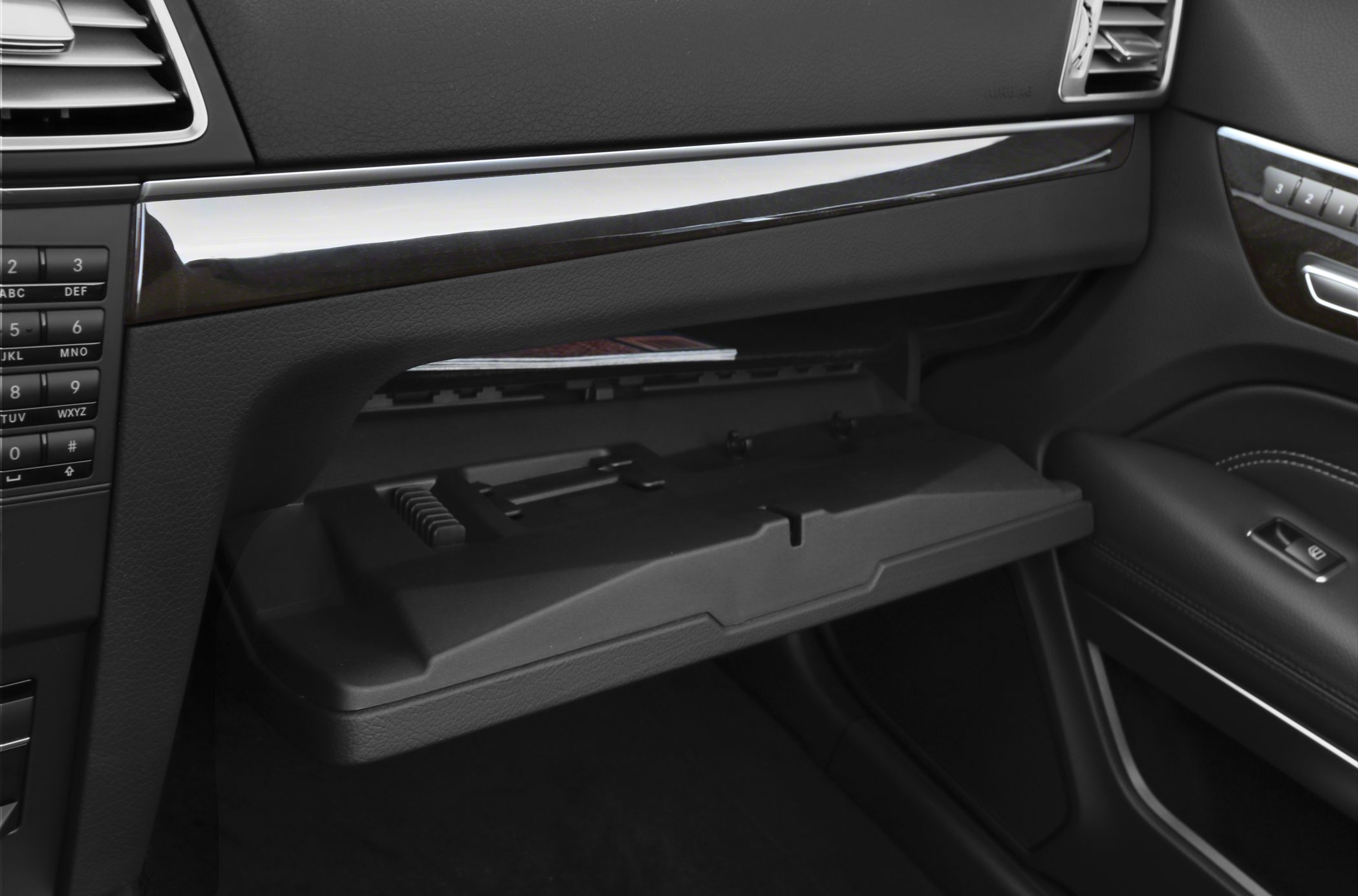 Open glove compartment in luxury car interior with sleek design