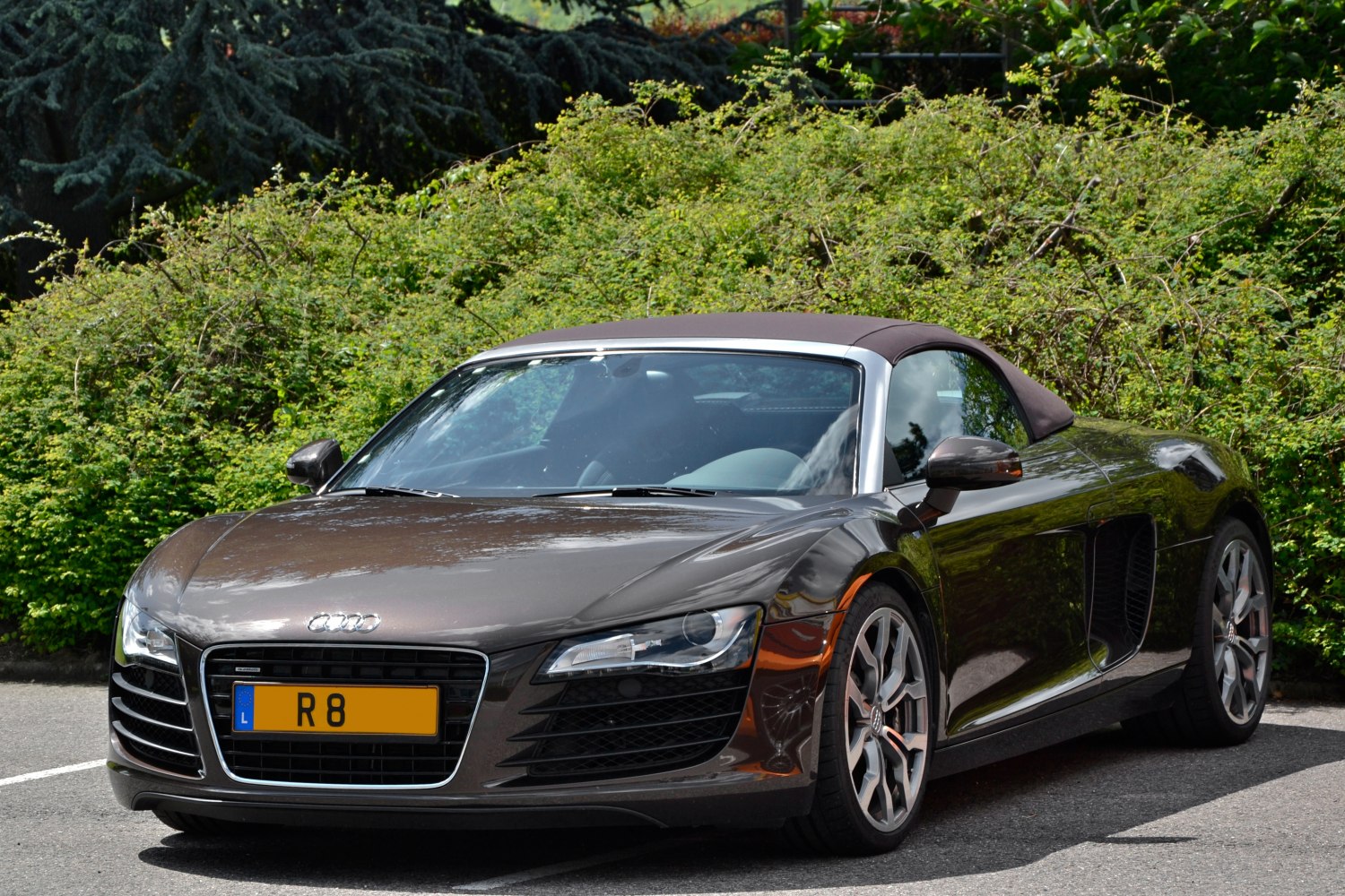Front view of a convertible sports car with sleek headlights and aerodynamic shape