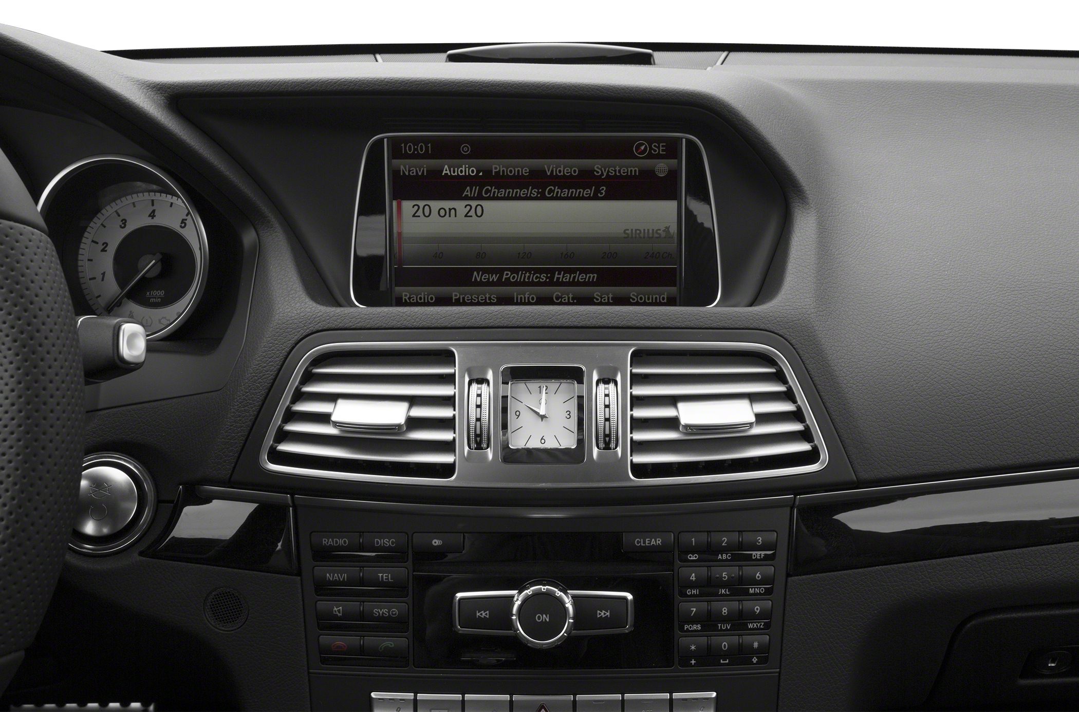 Dashboard with analog clock and infotainment screen