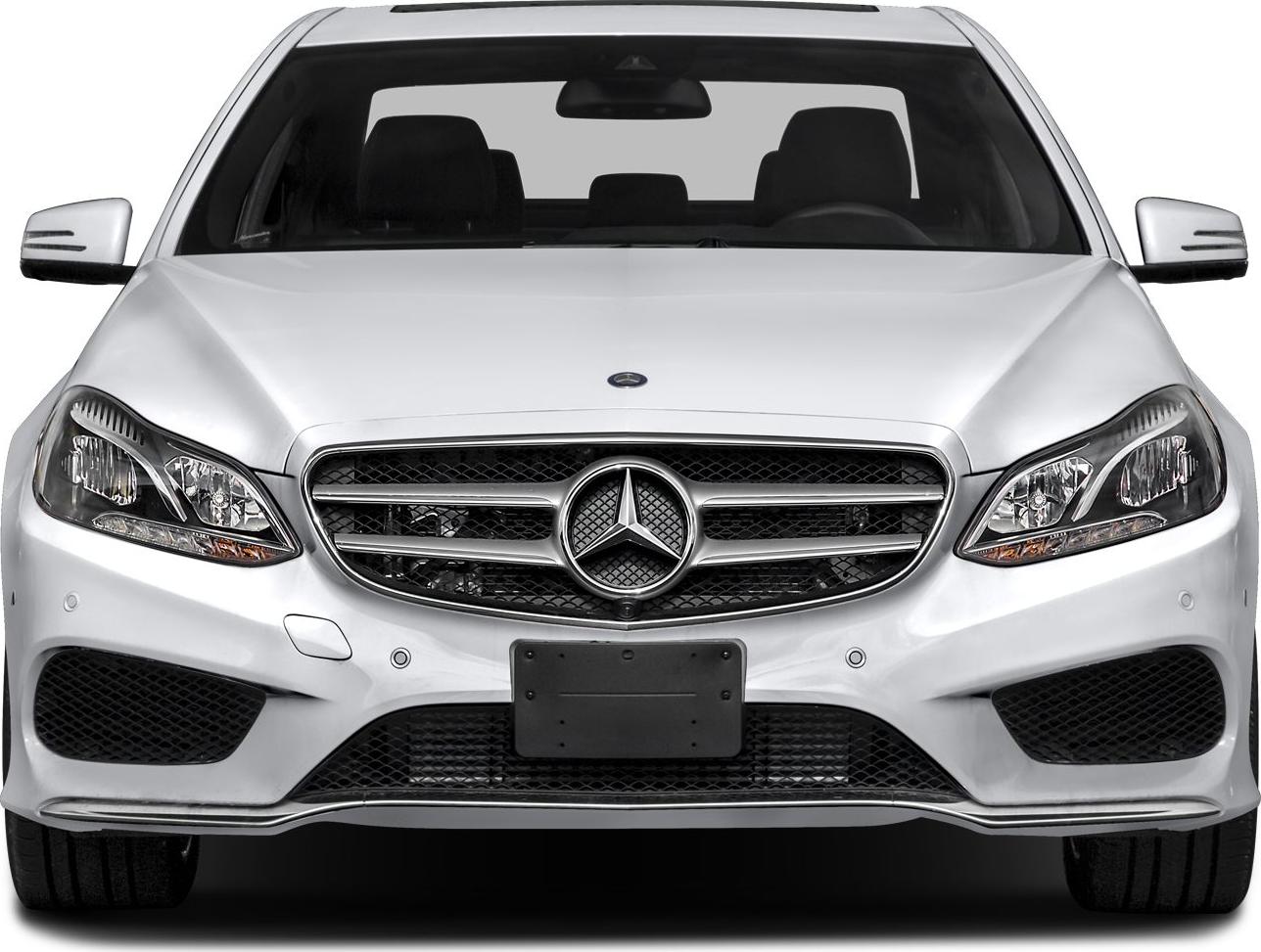 Front view displaying grille and headlights of luxury sedan