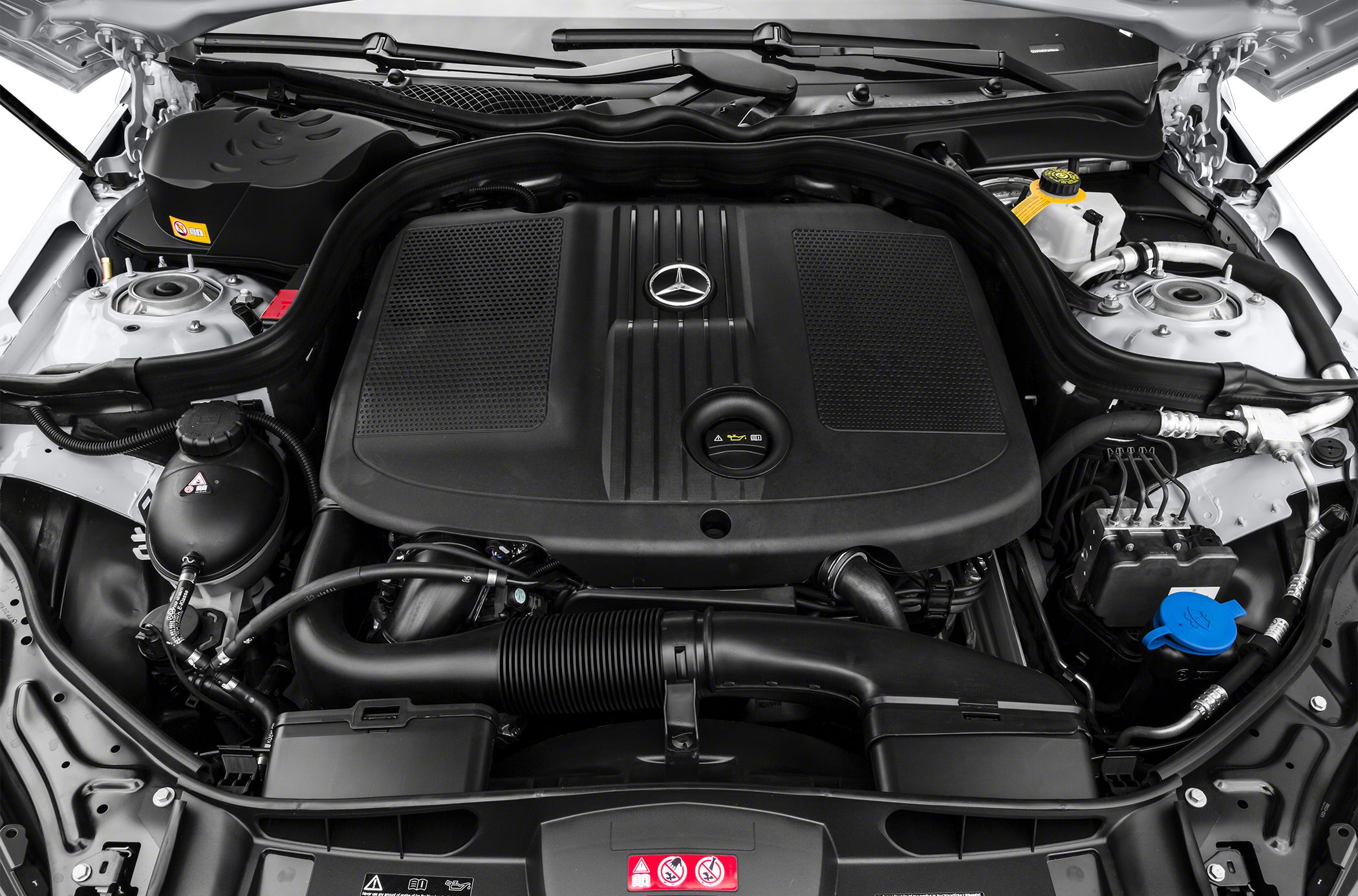 Engine bay with large central engine cover and organized components