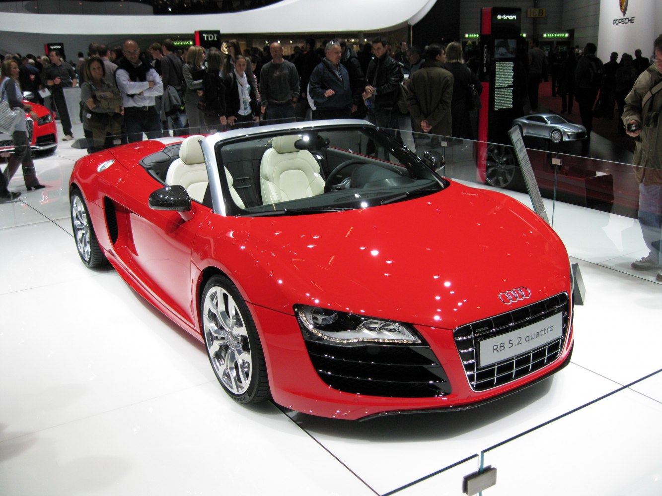 Red convertible sports car with LED headlights and chrome wheels