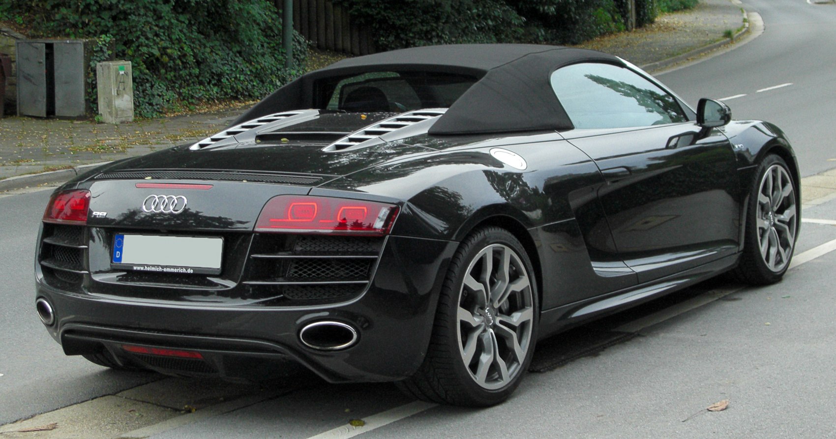 Convertible sports coupe rear view with LED taillights and soft top