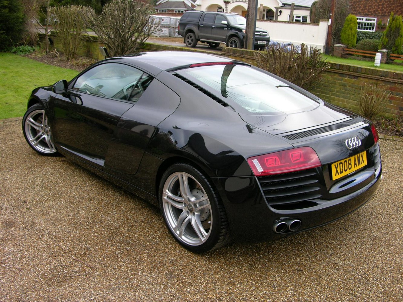 Rear and side profile with rear lights and dual exhaust