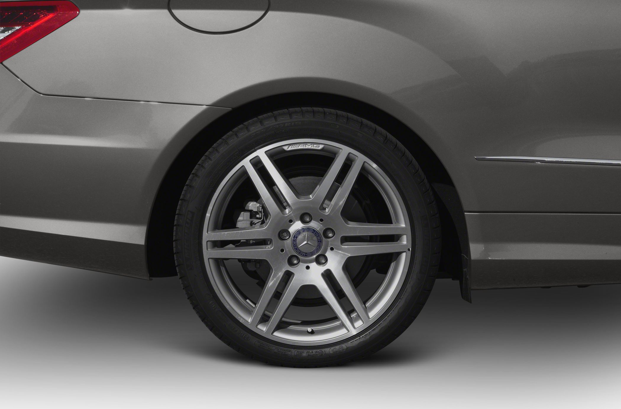 Close-up of AMG alloy wheel and brake caliper on rear fender
