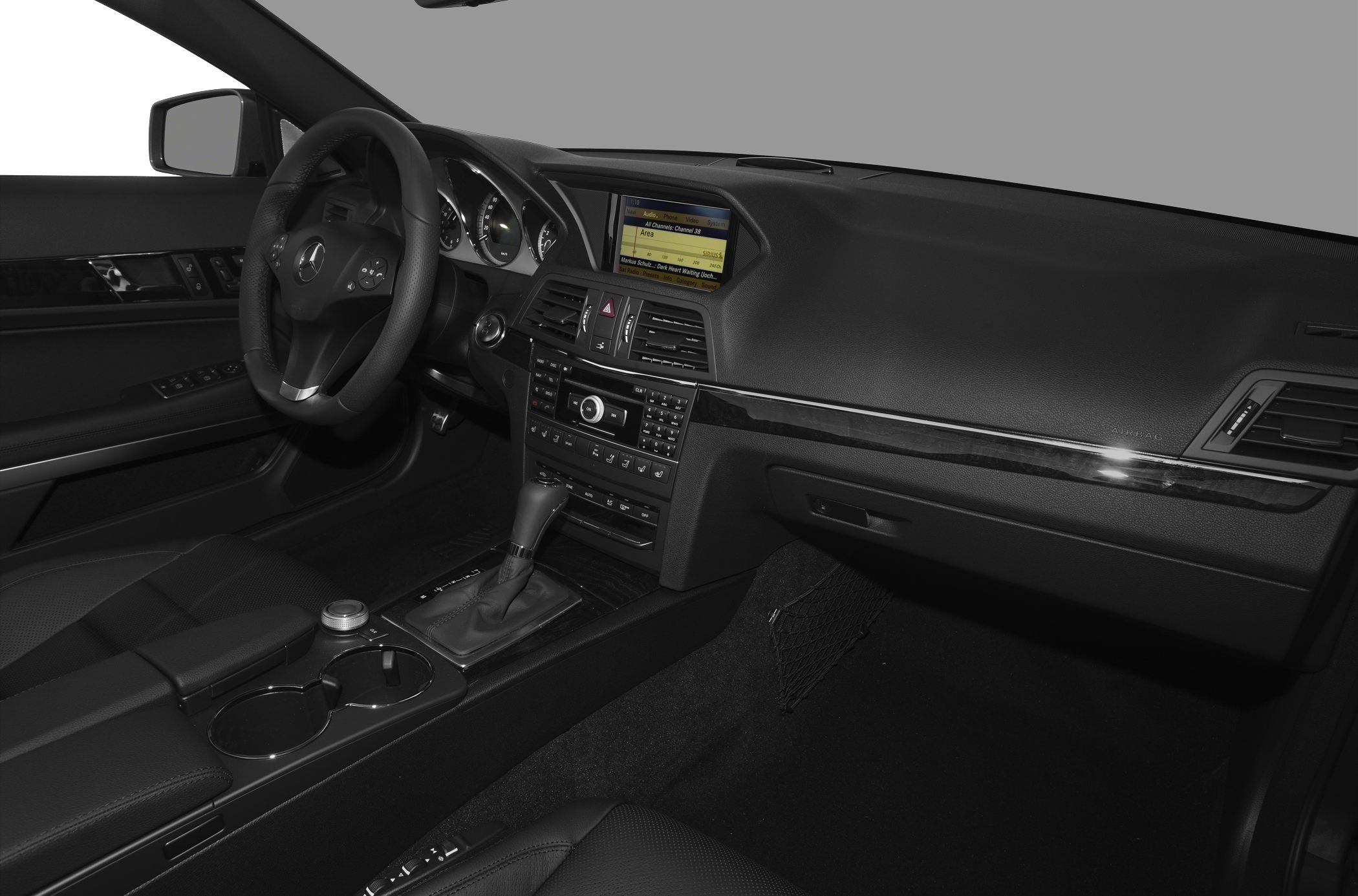 Luxury car interior with dashboard, steering wheel, and center console