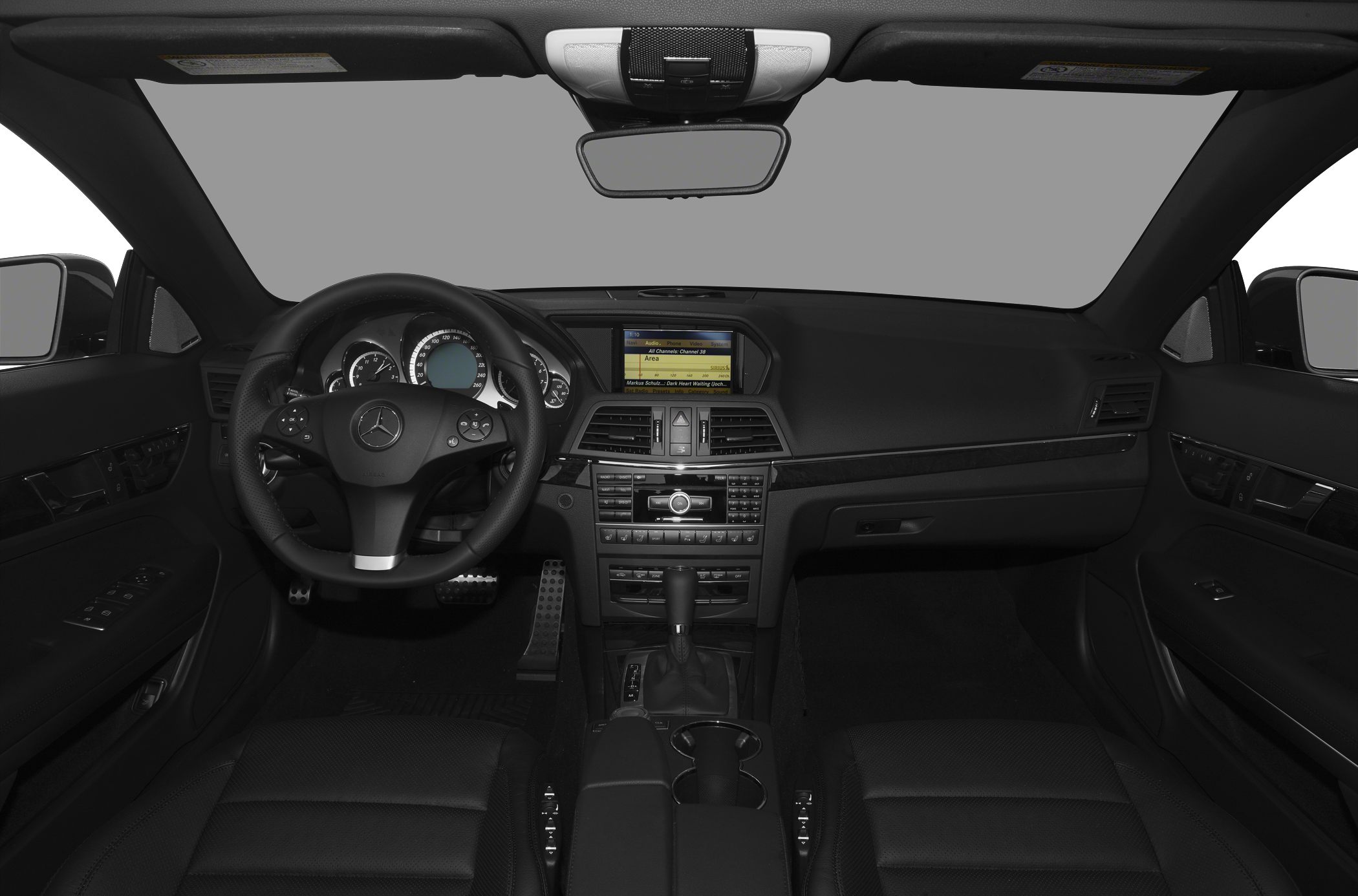 Luxury convertible interior with detailed dashboard and steering wheel