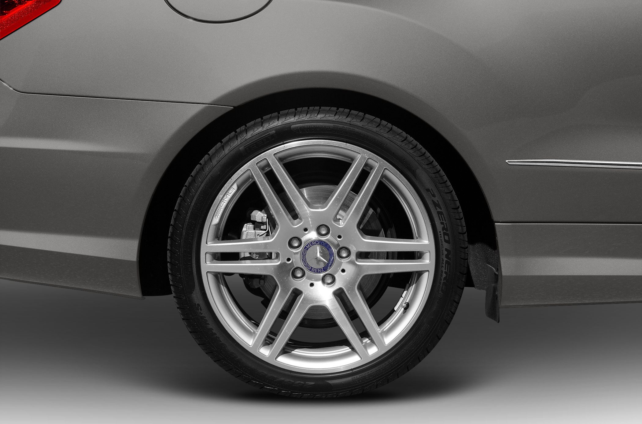 AMG alloy wheel with Pirelli P Zero tire on car rear side
