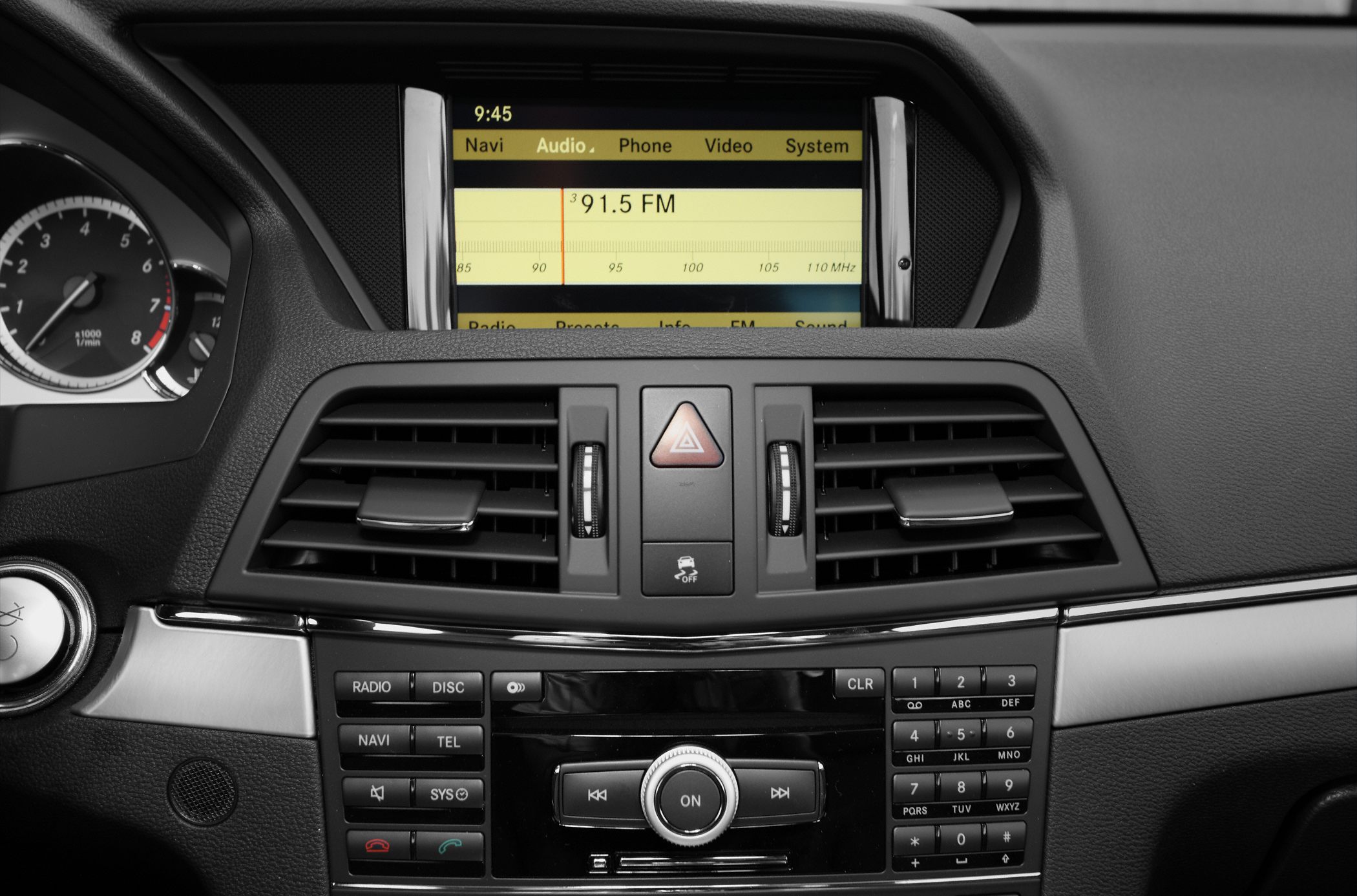 Dashboard with central infotainment screen and control buttons