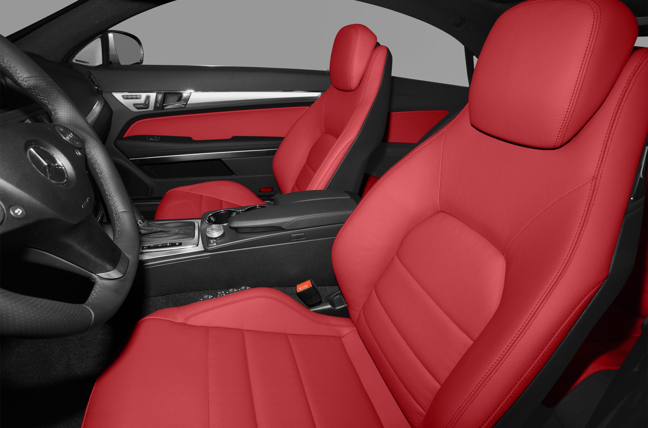 Red leather seats and black interior trim with steering wheel and center console