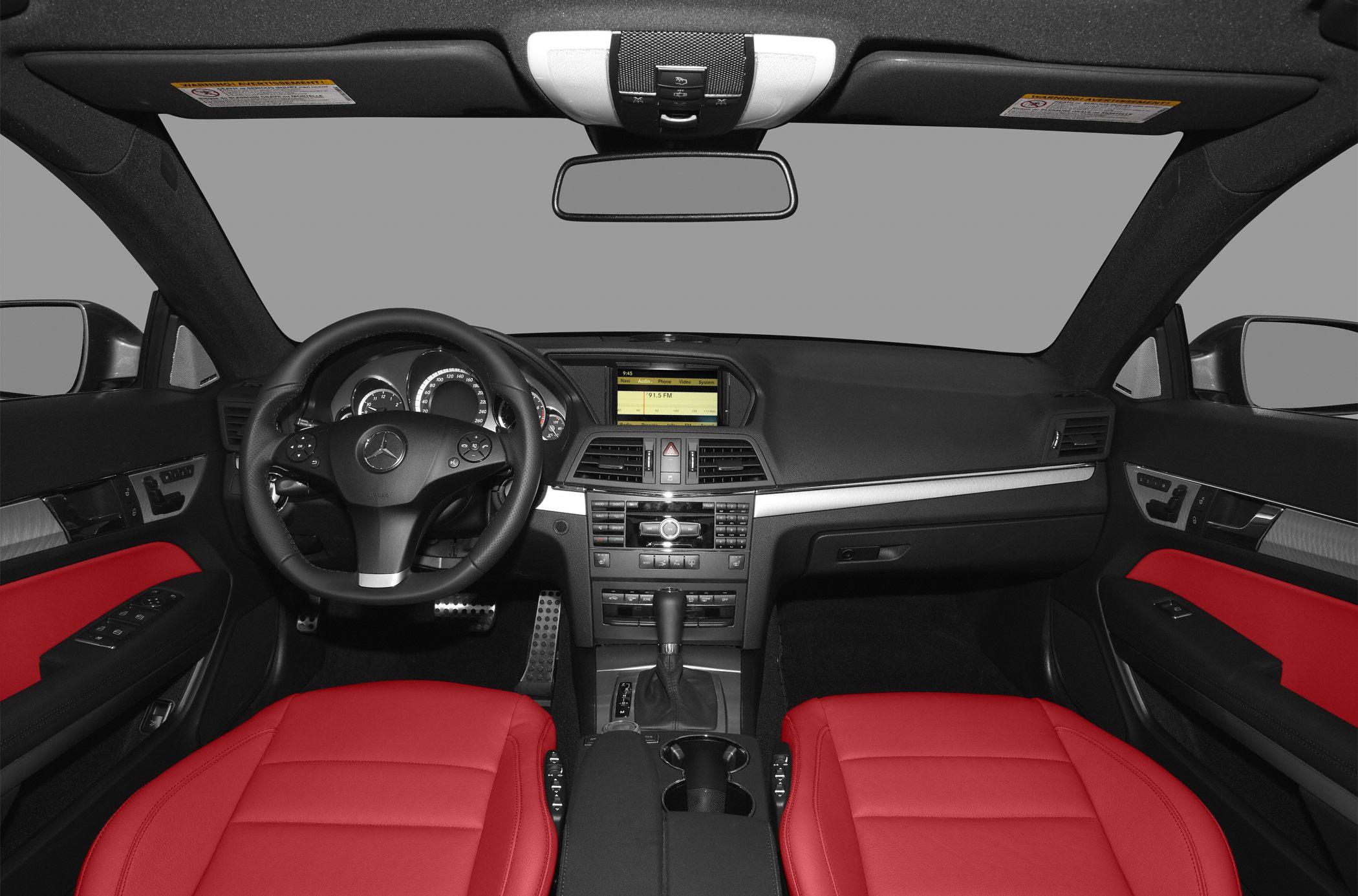 Red leather seats and modern dashboard with infotainment system