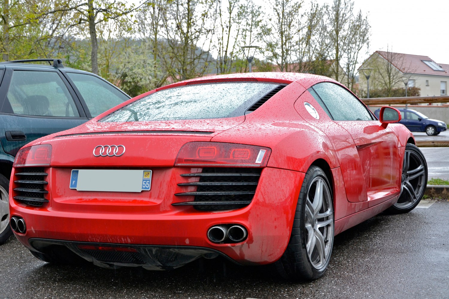 Sleek rear view with dual exhausts and distinctive tail lights
