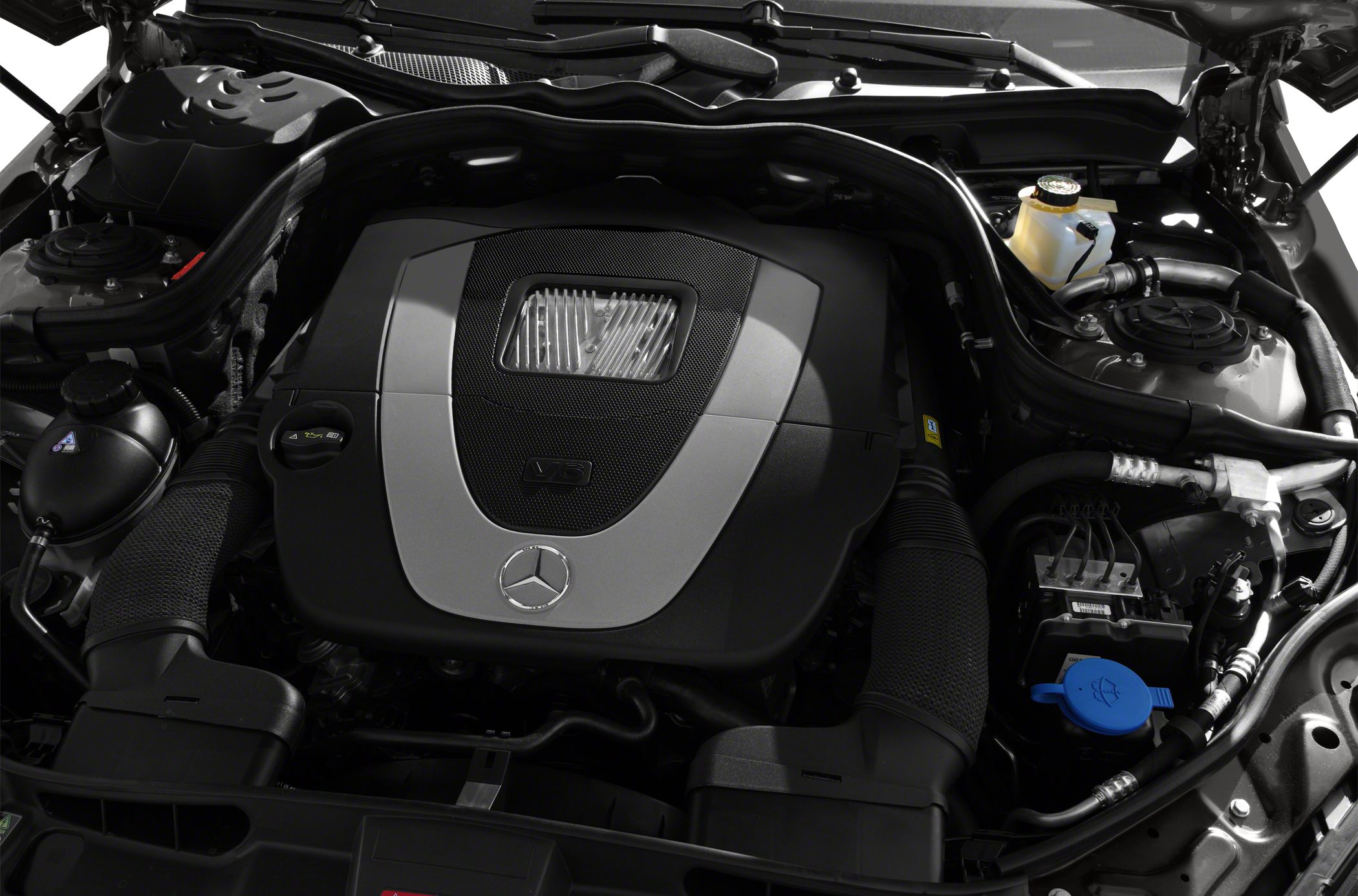 V6 engine compartment with Mercedes emblem and air intake ducts