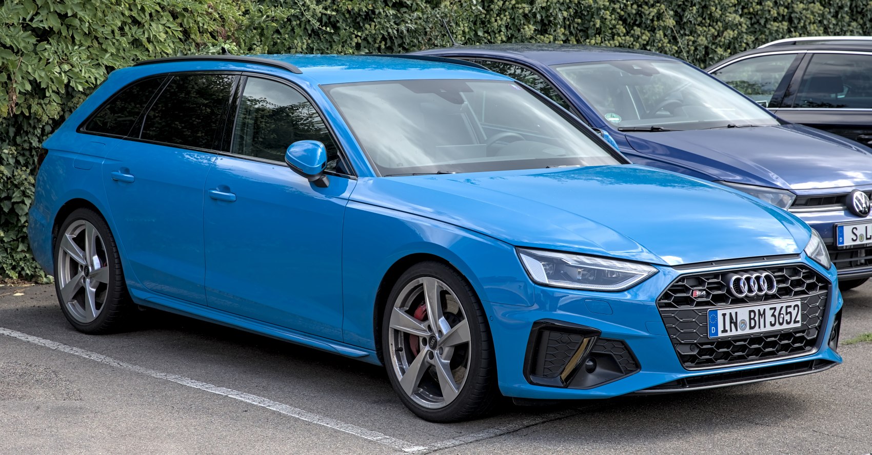 Front angle view showing aggressive hexagonal grill and sporty headlights.