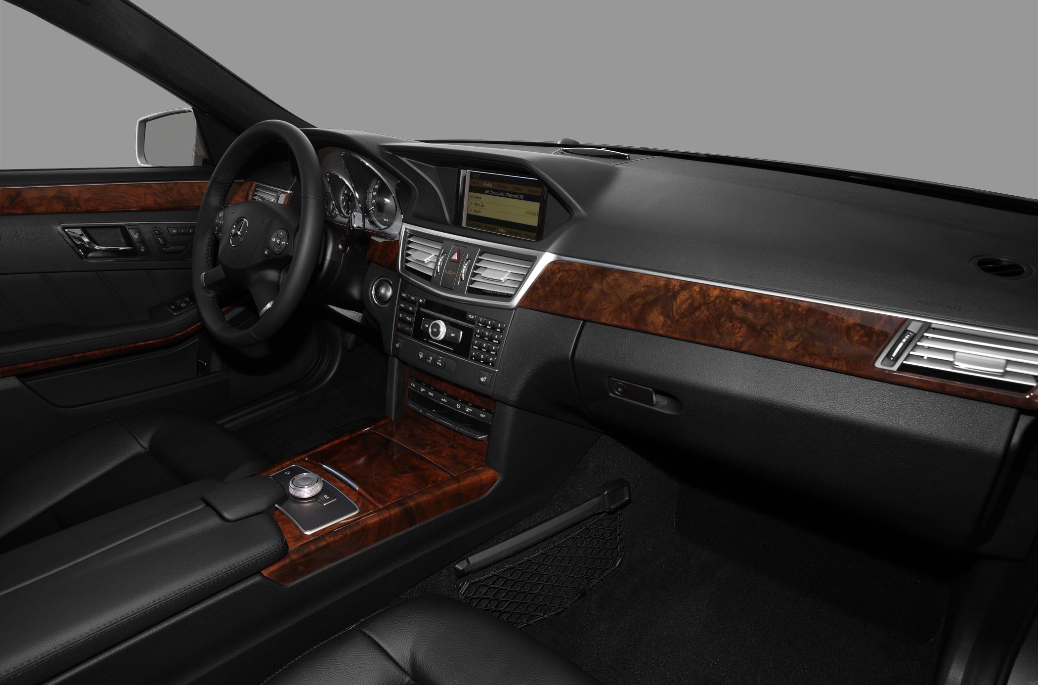 Interior dashboard with wood trim and modern control panel