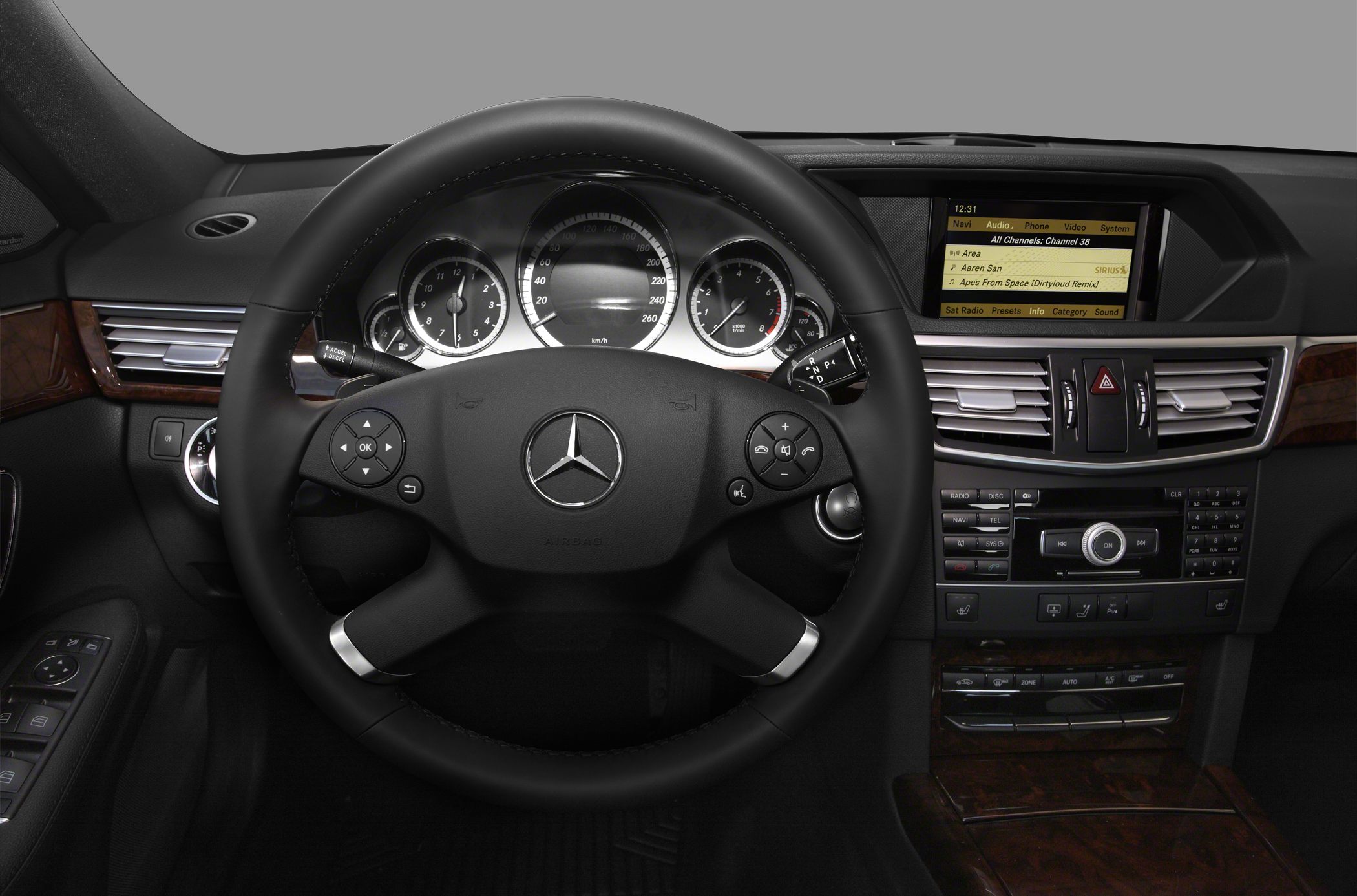 Dashboard, steering wheel with integrated controls, and central infotainment display