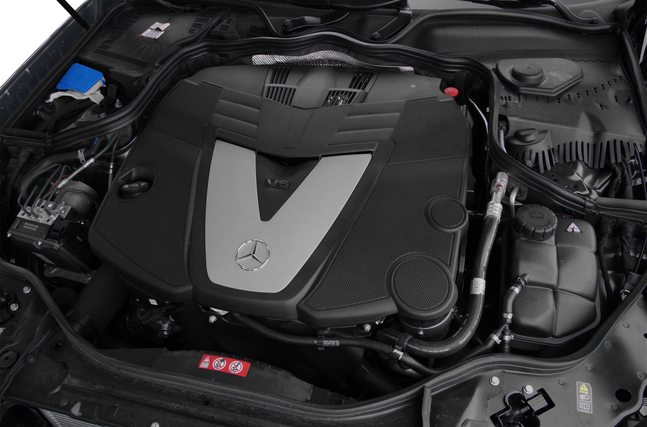 V6 engine with distinctive Mercedes-Benz cover in engine bay