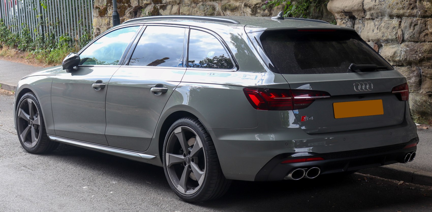 Rear and side profile with quad exhaust and tinted windows