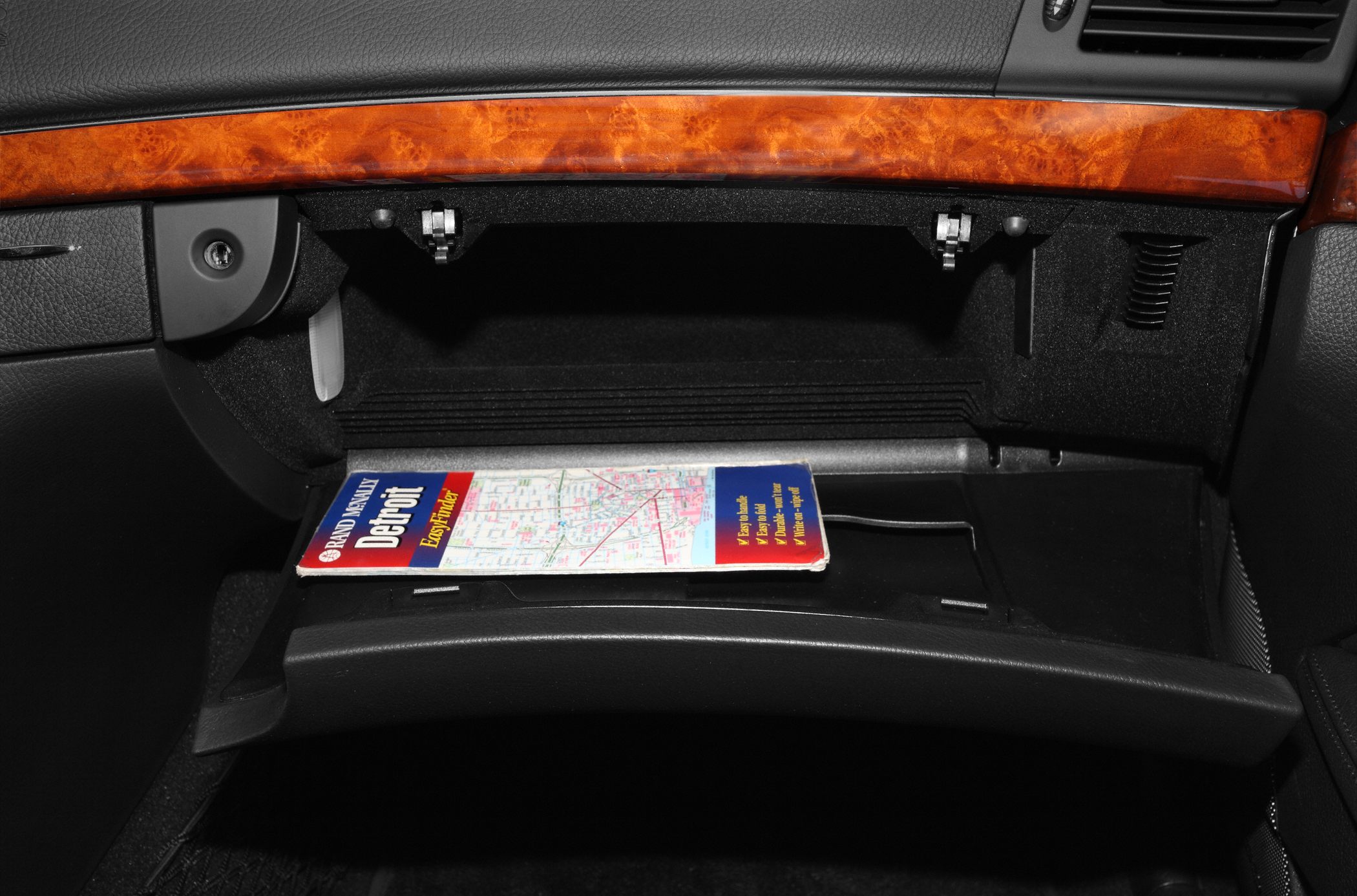 Glove compartment with wood trim and map inside